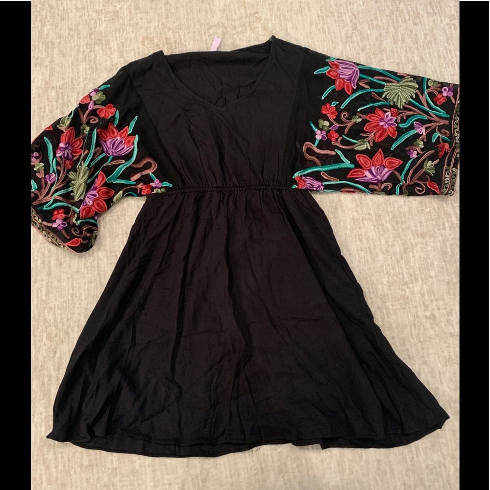 Black dress with embroidered sleeves